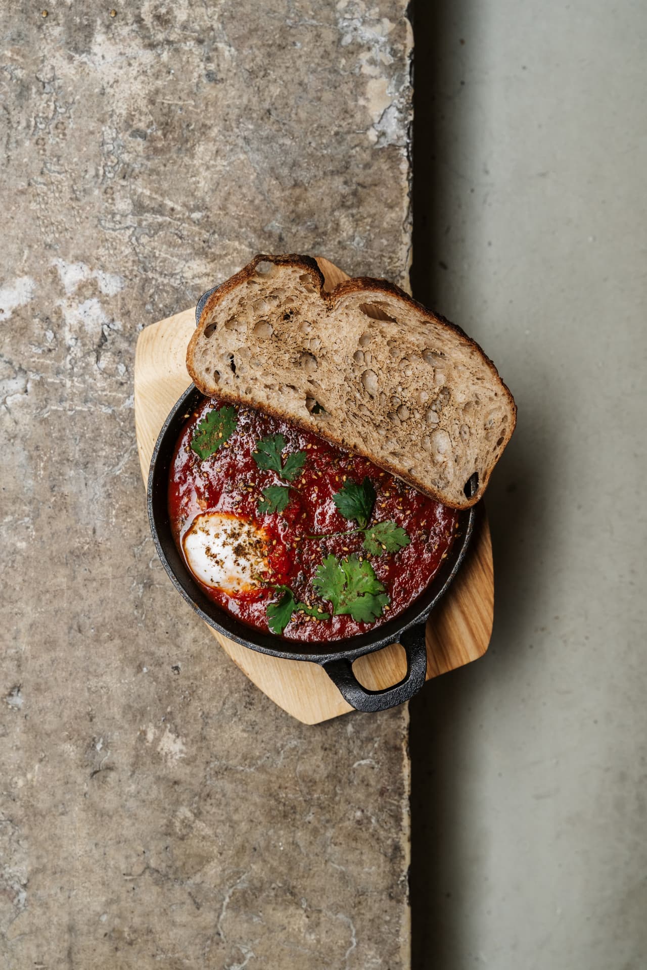 Shakshuka served in a cast-iron pan